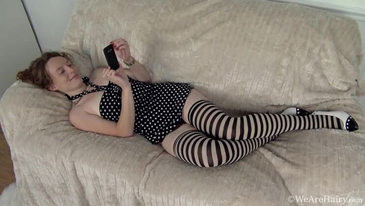 Redhead Ana Molly Fingers Herself on the Sofa