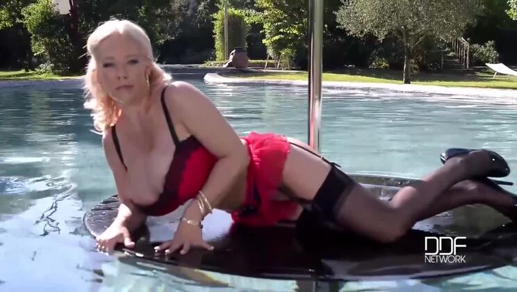 Poolside Pole Dancing with Delz Angel: Big Tits in Lingerie